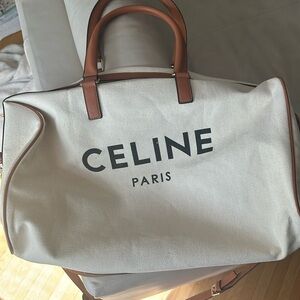 Off white and tan duffle bag